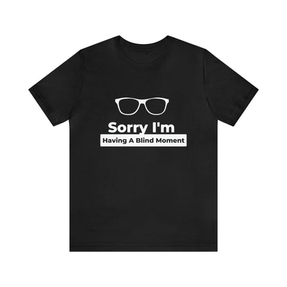 Black t shirt design has reading glasses (sorry i'm having a blind moment white letters